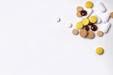 pills on a white  background with copyspace macro wiew