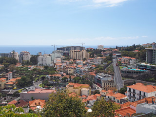 Fototapeta na wymiar an aerial view of funchal in in madeira with roads running thought the center of the city and buildings in front of the sea