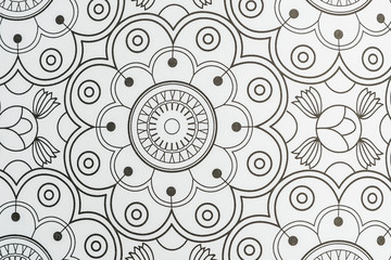 Arrière plan noir et blanc au motif graphique fleuri