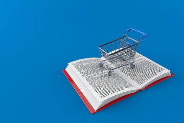 Shopping cart on open book © Talaj