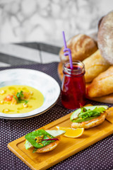 breakfast on the table sandwiches soup and bread