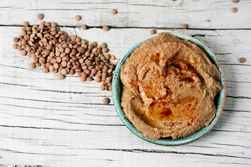 plate with homemade lentil hummus on a table