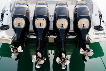 Four outboard motors on a speed boat