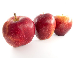 Three red apples isolated on white background
