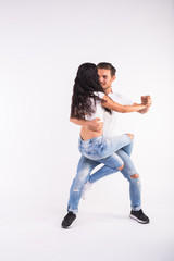 Salsa, kizomba and bachata dancers on white background. Social dance concept