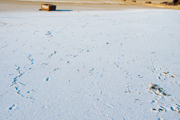 Salt mine in Milos island in Greece. It is one of the oldest salt pits in Greece. Dried crystallized sea salt in the ground