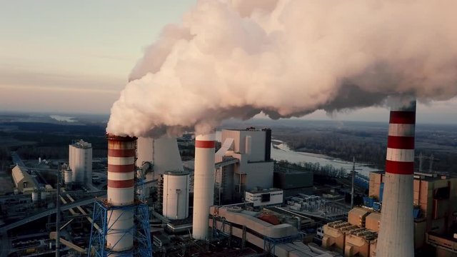 Dron shot of power station chimney producing smoke
