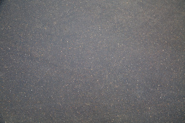 Background of wet dark asphalt. Backgrounds graphic design textures.