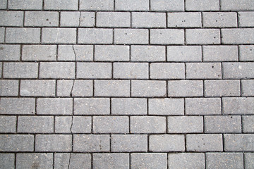 Background from grey artificial paving stone of rectangular shape. Backgrounds graphic design  textures.