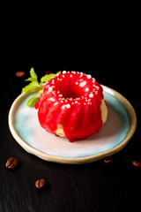 Food bakery concept homemade summer red berry sponge cake on black slate stone plate