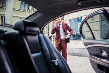 Businessman driving in a stretch limo