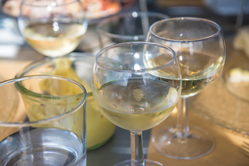 Blurred wineglasses background on sunlignt