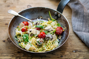 Courgette pasta with meat balls and tomatoes