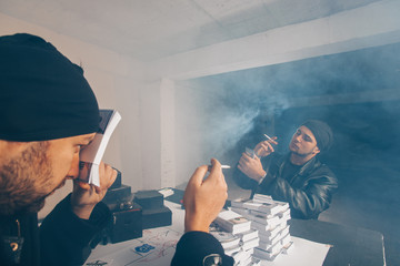 Men in black counting money