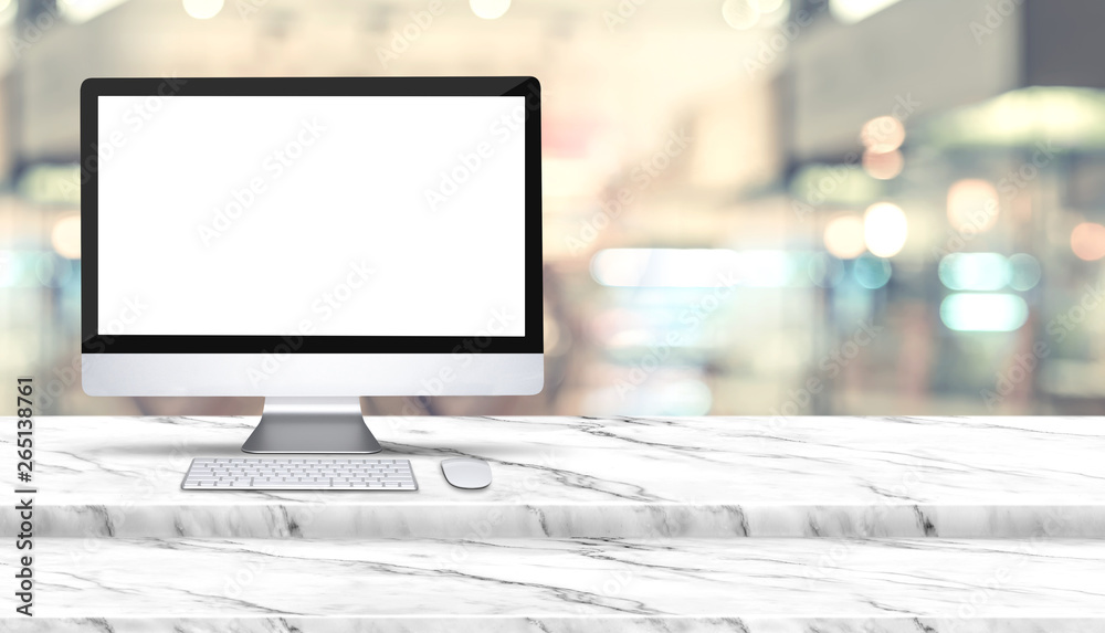 Poster blank screen of desktop computer on step white marble table with blur restaurant at background,mock 