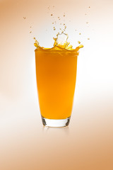 Splash on a glass of orange juice