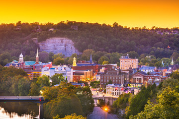 Frankfort, Kentucky, USA town skyline on the Kentucky River at dusk.