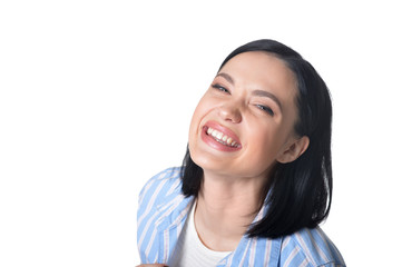 Portrait of smiling young woman on white background