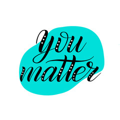 You matter. Black brush pen lettering on mint green abstract background. Calligraphic cursive. Handwritten short encouraging phrase. Classical script. Vector isolated design element for greeting cards