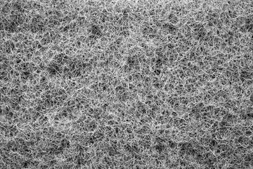 Textured background sponge for dishes.