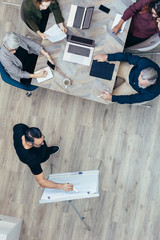 Businessman giving presentation to colleagues