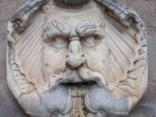 Fototapeta na wymiar Fontana del Mascherone di Santa Sabina. Roma, Italia