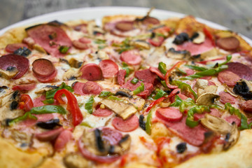 Delicious pizza served on porcelain plate