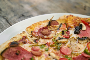 Delicious pizza served on porcelain plate