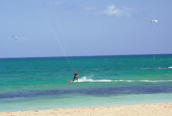 Kite surfing: sport and fun with the strong wind of Fuerteventura, Canary Islands. Spain