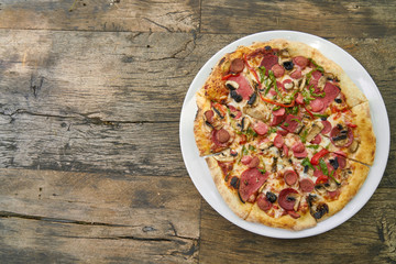 Delicious pizza served on porcelain plate