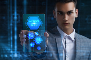 The concept of business, technology, the Internet and the network. A young entrepreneur working on a virtual screen of the future and sees the inscription: Action plan