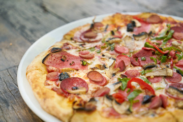 Delicious pizza served on porcelain plate