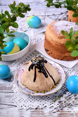 Easter table setting; easter cakes, colored eggs and cottage cheese paskha