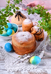 Easter table setting; easter cakes, colored eggs and cottage cheese paskha