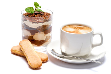 Classic tiramisu dessert in a glass and cup of coffee isolated on a white background with clipping path