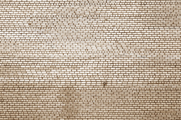 Pattern of brick wall with blur effect in brown tone.