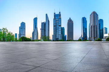 Obraz premium Shanghai modern commercial office buildings and square floor at dusk