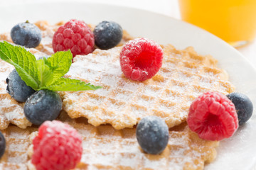 sweet Belgian waffles with fresh berries, close-up