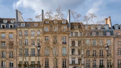 Paris, beautiful building in the center, typical parisian facade in the Marais, rue Saint-Martin 