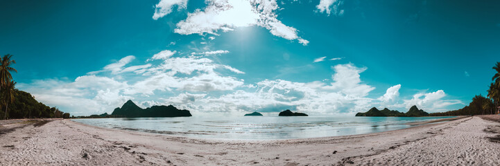Relaxing seascape tropical paradise beach with white sand and island in the sea.