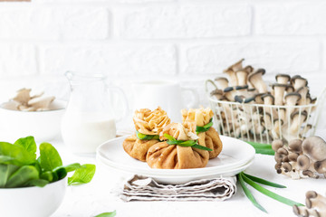 Pancake bags stuffed with with fried oyster mushrooms with spinach