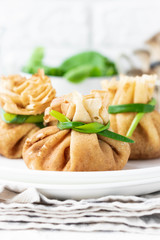 Pancake bags stuffed with with fried oyster mushrooms with spinach