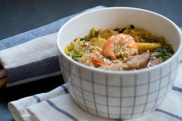 Seafood and pork sukiyaki in white bowl