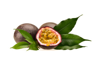 Arrangement of two purple passion fruit and half with ripe yellow flesh on a neutral white...