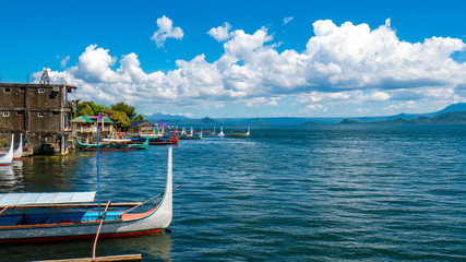 Boats rocking on the wawes of Lake Taal in Philipines