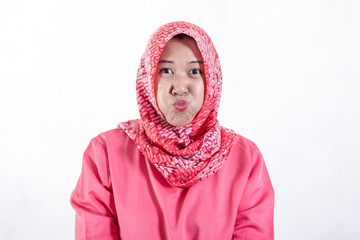 Asian muslim businesswomen wearing hijab with funny expression. Isolated on white background