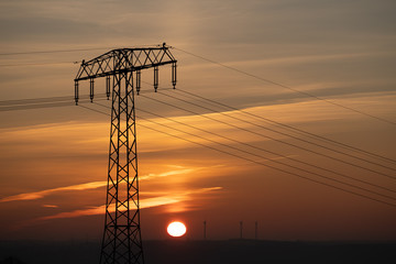 Power line and wind generator at early morning