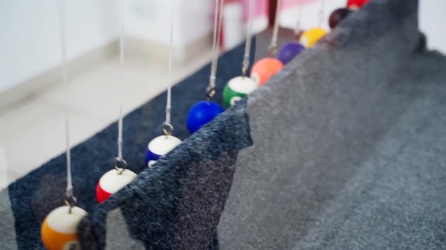 Newton's cradle showing laws of physics in motion