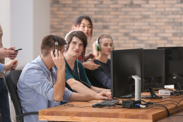 Young people playing video games at tournament