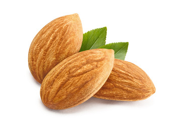 Obraz na płótnie Canvas Close-up of three almonds, isolated on white background